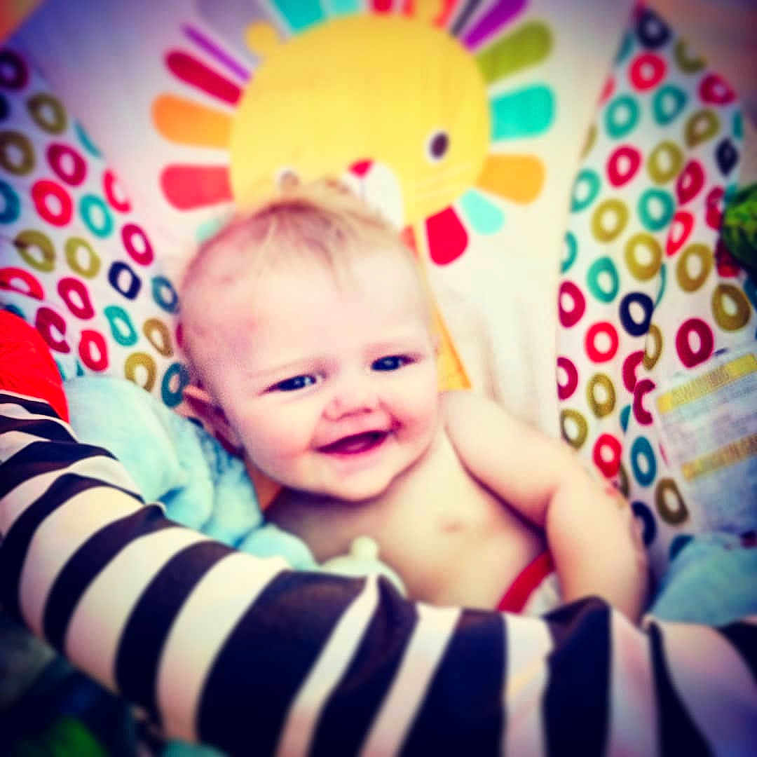 Valerian joined the competition — help win amazing prizes! baby, smiling, child, infant, face, colorful, pattern, seat, striped, arm, cheerful, sun_design, playful, indoors, cushion, happy, portrait, closeup, skin, head