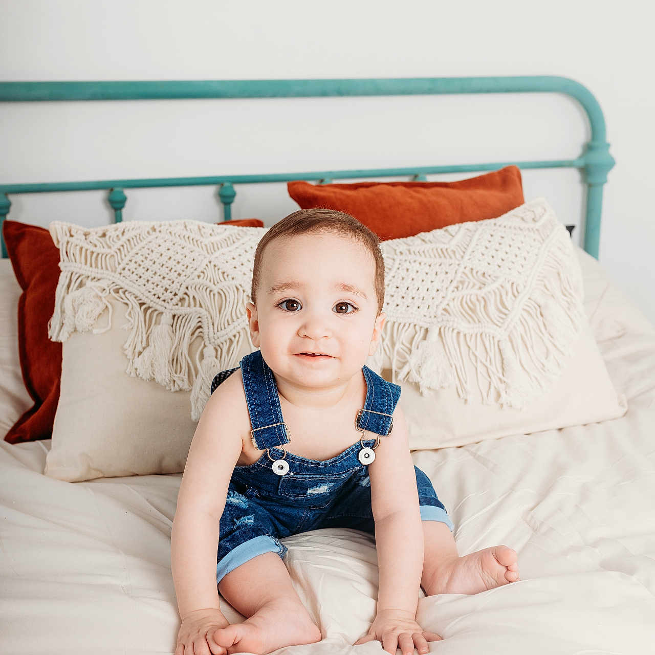 Kayden joined the competition — help win amazing prizes! baby, bed, bedroom, clothing, cushion, face, furniture, happy, head, homedecor, indoors, jeans, pants, person, photography, pillow, portrait, room, sitting, smile