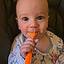 baby, child, spoon, high_chair, onesie, giraffe_pattern, face, hand, eating, curious, indoor, closeup, infant, feeding, messy_face, seatbelt, cute, expression, person, young_child