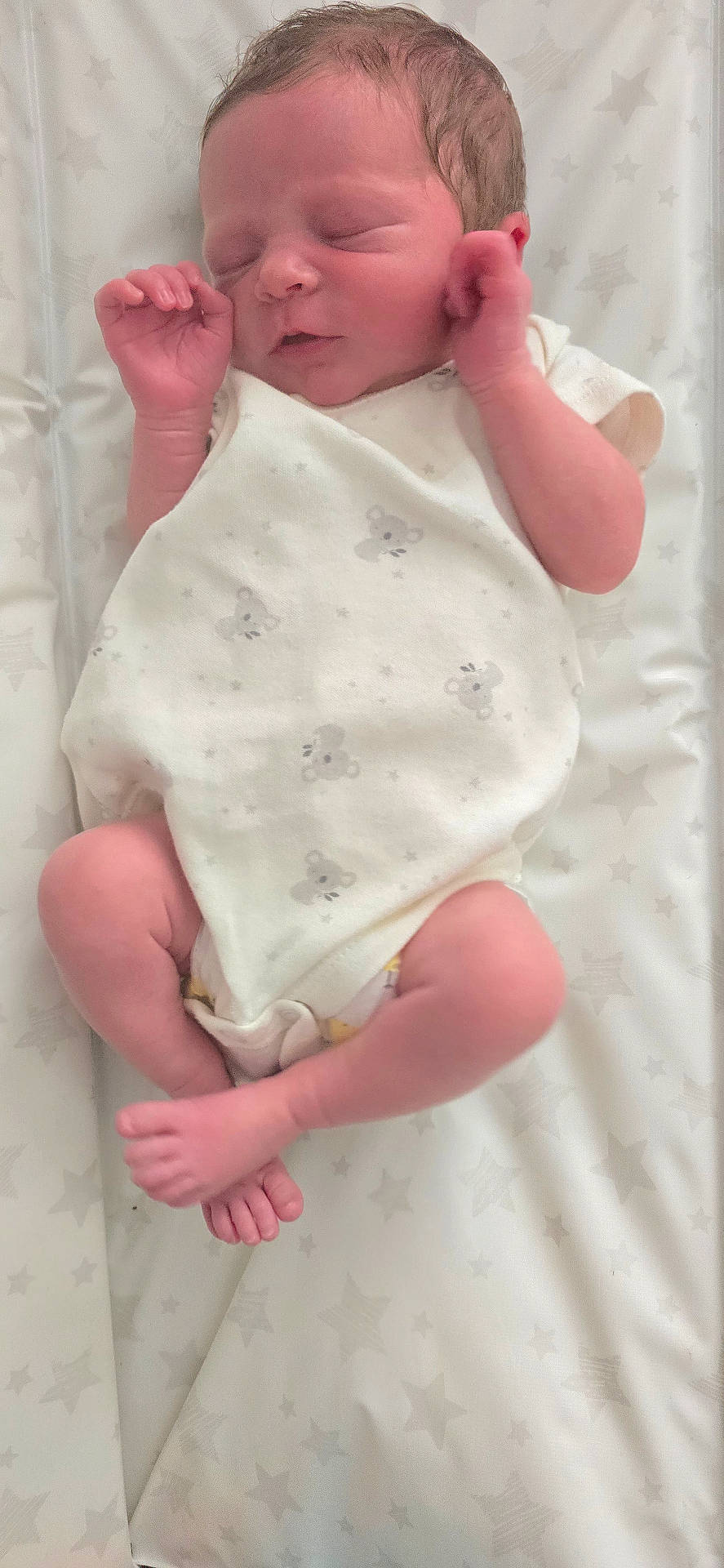 baby, child, cute, delicate, fingers, indoors, infant, koala_print, mattress, newborn, onesie, peaceful, portrait, resting, sleeping, soft, star_pattern, toes, white, young