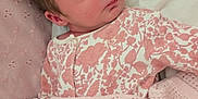 Hattie joined the competition — help win amazing prizes! newborn, baby, sleeping, blanket, pink, floral_pattern, onesie, pillow, bed, soft_texture, cute, infant, peaceful, rest, indoors, child, face, hand, cozy, portrait