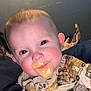 Asher joined the competition — help win amazing prizes! baby, infant, child, face, messy_face, baby_food, onesie, stains, red_cheeks, smile, eyes, hair, hand, adult_hand, pouch, bedding, bedroom, wall, portrait, close_up