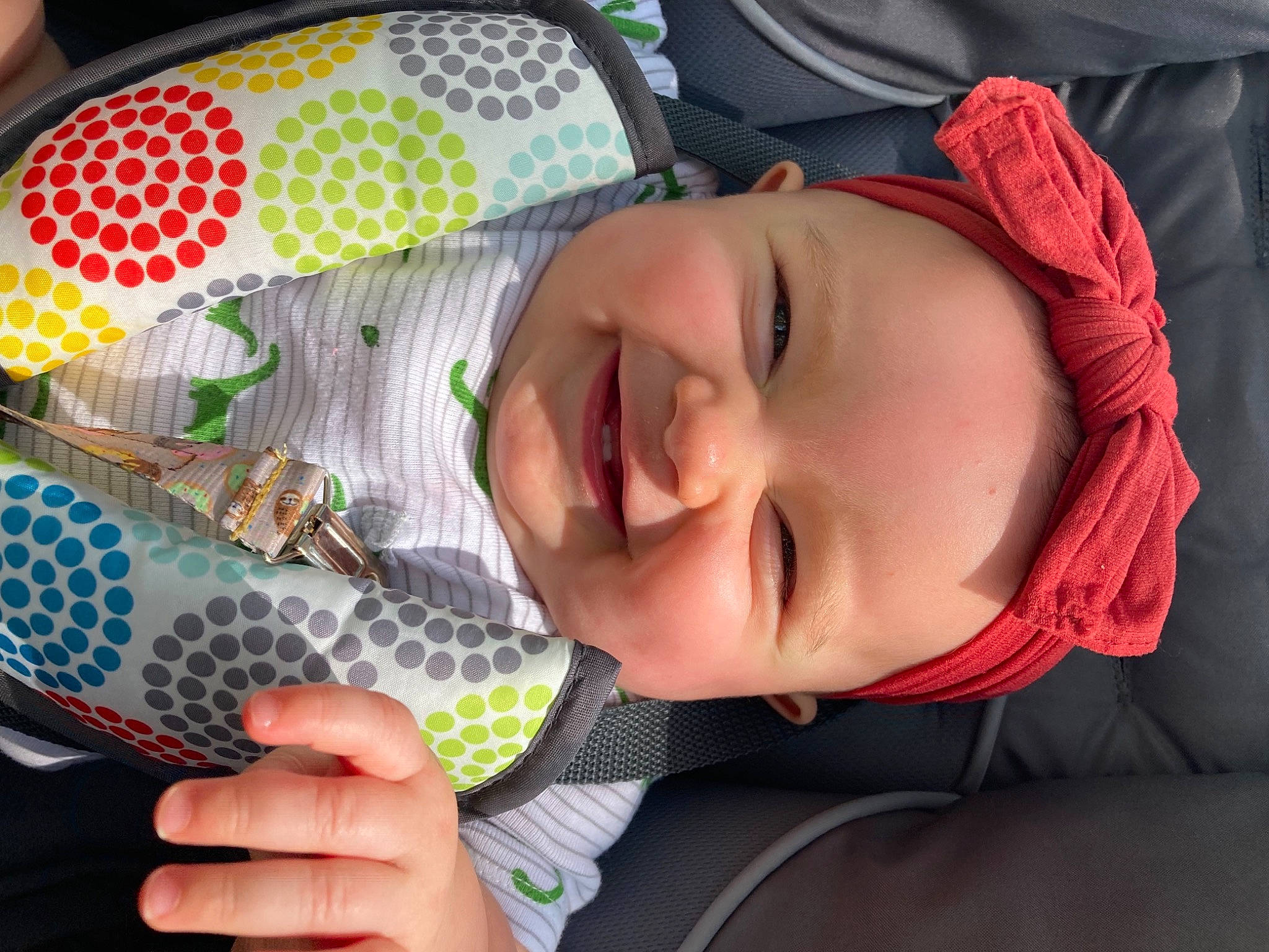 Lilith is registered to the contest to win money with this photo: baby, baby_laughing, baby_products, baby_toddler_clothing, child, facial_expression, fashion_accessory, finger, fun, grass, happy, headwear, joy, lip, mouth, nose, pattern, person, personal_protective_equipment, product