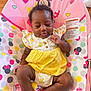 baby, infant, child, sleeping, cute, mickey_mouse, minnie_mouse, baby_seat, colorful, yellow_clothing, polka_dots, heart_shapes, wooden_floor, indoors, comfortable, peaceful, smiling, small_hands, soft_fabric, casual
