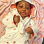 Kaycee joined the competition — help win amazing prizes! baby, infant, child, robe, hood, blanket, rainbow, pattern, pink, white, soft, cute, smile, face, hand, fingers, lying_down, cozy, warm, indoors