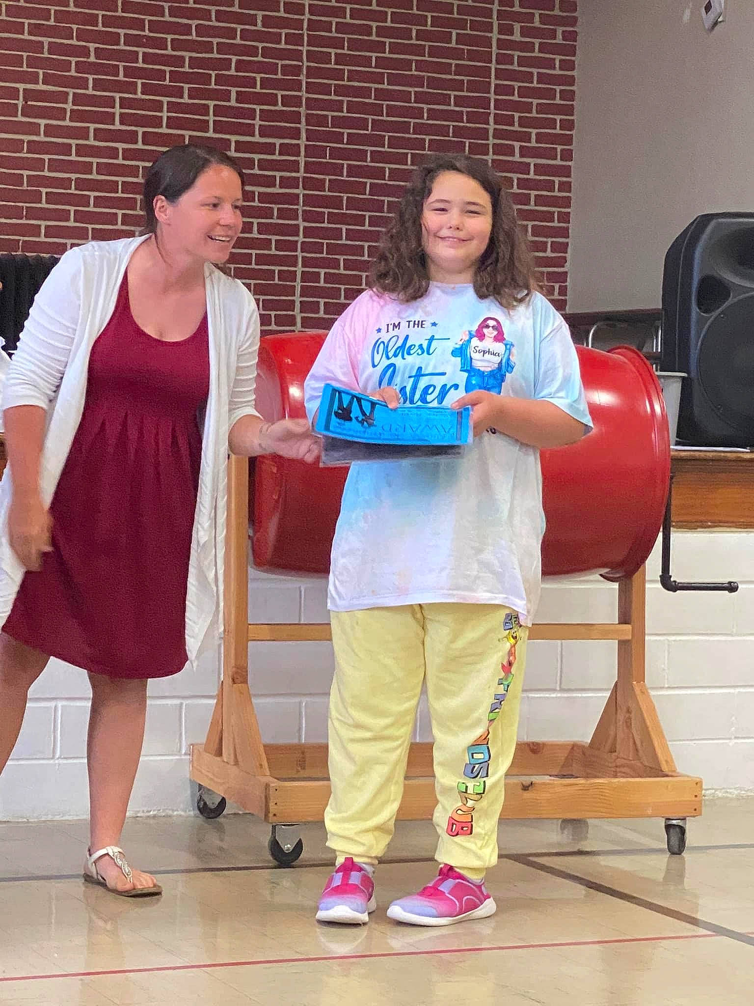 Sophia Reagan Persell is registered to the contest to win money with this photo: balloon, beauty, chair, child, event, facial_expression, flooring, fun, happy, joint, joy, leisure, magenta, person, pink, purple, room, sandal, shoulder, smile