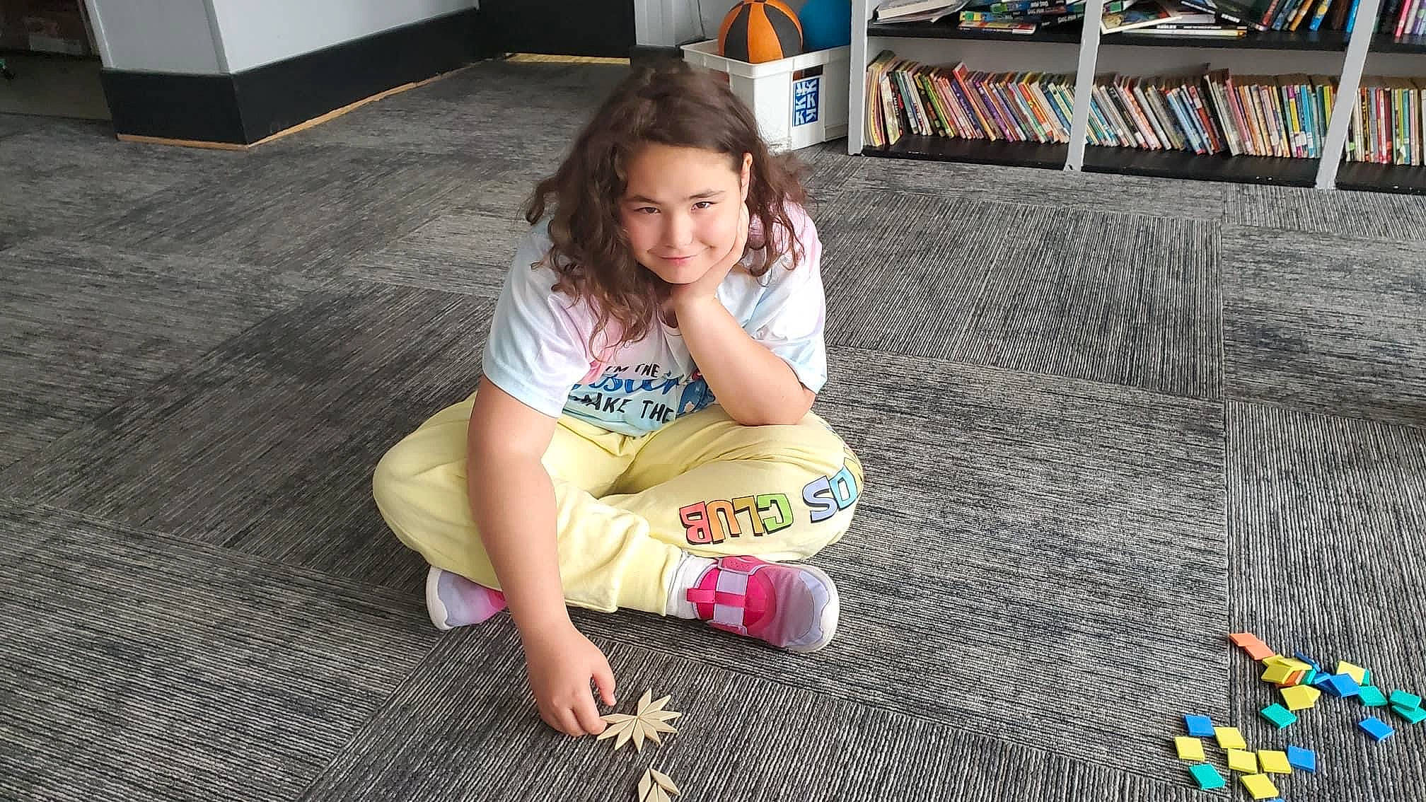 Sophia Reagan Persell joined the competition — help win amazing prizes! child, floor, flooring, foot, fun, happy, human_body, human_leg, joy, knee, lap, leisure, person, recreation, shelf, smile, snapshot, t_shirt, thigh, toddler