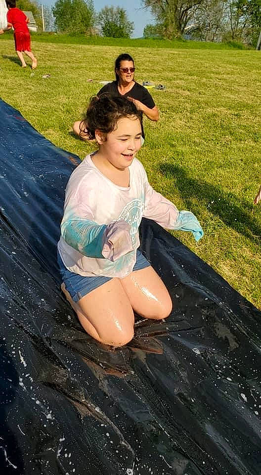 Sophia Reagan Persell joined the competition — help win amazing prizes! barefoot, black_hair, child, flash_photography, fun, grass, happy, human_leg, joy, leisure, outdoor_recreation, people_in_nature, person, personal_protective_equipment, play, recreation, sitting, smile, t_shirt, thigh