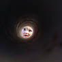 Adèle a rejoint le concours — aidez-le/la à gagner de superbes lots ! baby, face, blue_eyes, curious, tube, dark_background, circle, child, closeup, portrait, innocent, peeking, expression, light, shadow, cute, person, looking, mouth, head