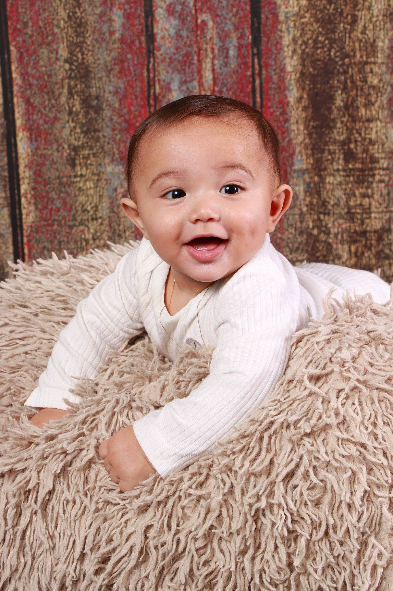 Jordyn is registered to the contest to win money with this photo: baby_toddler_clothing, child, curtain, event, flash_photography, flooring, fur, grass, happy, iris, natural_material, outerwear, pattern, person, portrait_photography, sitting, sleeve, smile, toddler, window