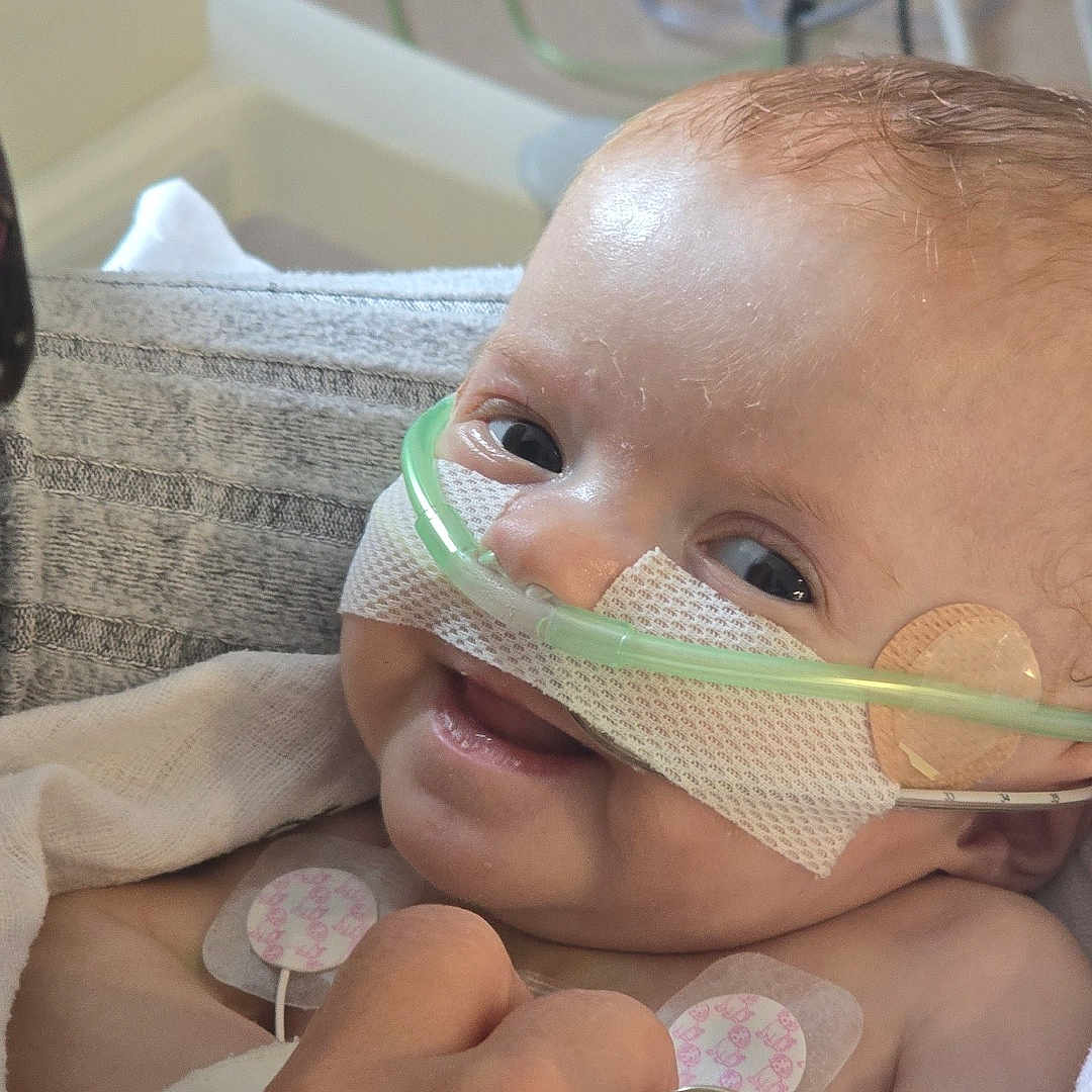 Elijah is registered to the contest to win money with this photo: accessories, architecture, arm, baby, bed, bodypart, building, couch, face, finger, furniture, hand, head, hospital, jewelry, newborn, person, photography, portrait, ring