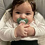baby, pacifier, child, infant, cute, hands, face, hair, clothing, sitting, indoors, closeup, expression, comfort, seat, portrait, soft, skin, young, adorable