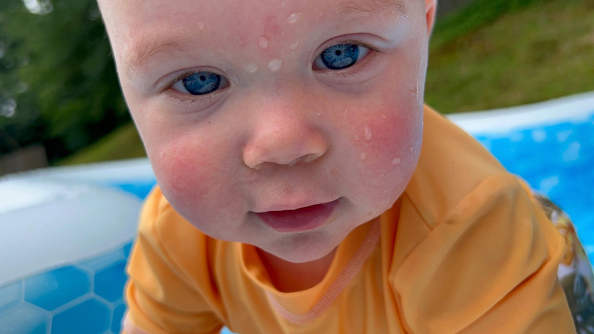 Cooper is registered to the contest to win money with this photo: baby, baby_toddler_clothing, blue, cheek, child, close_up, eyelash, finger, fun, grass, happy, headwear, iris, leisure, lip, mouth, nose, person, skin, smile