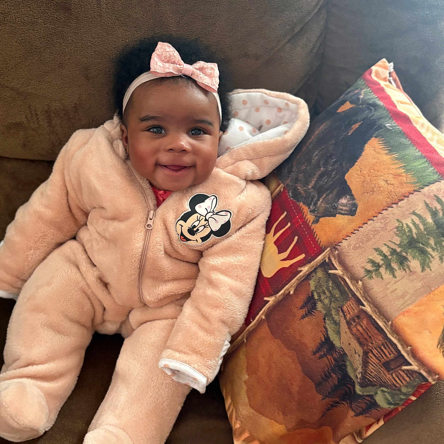 Dynasty Amour joined the competition — help win amazing prizes! baby, bow, brown_fabric, child, comfortable, couch, cozy, cute, happy, headband, indoor, infant, minnie_mouse, pillow, pink_onesie, plush_clothing, portrait, seated, smiling, warm