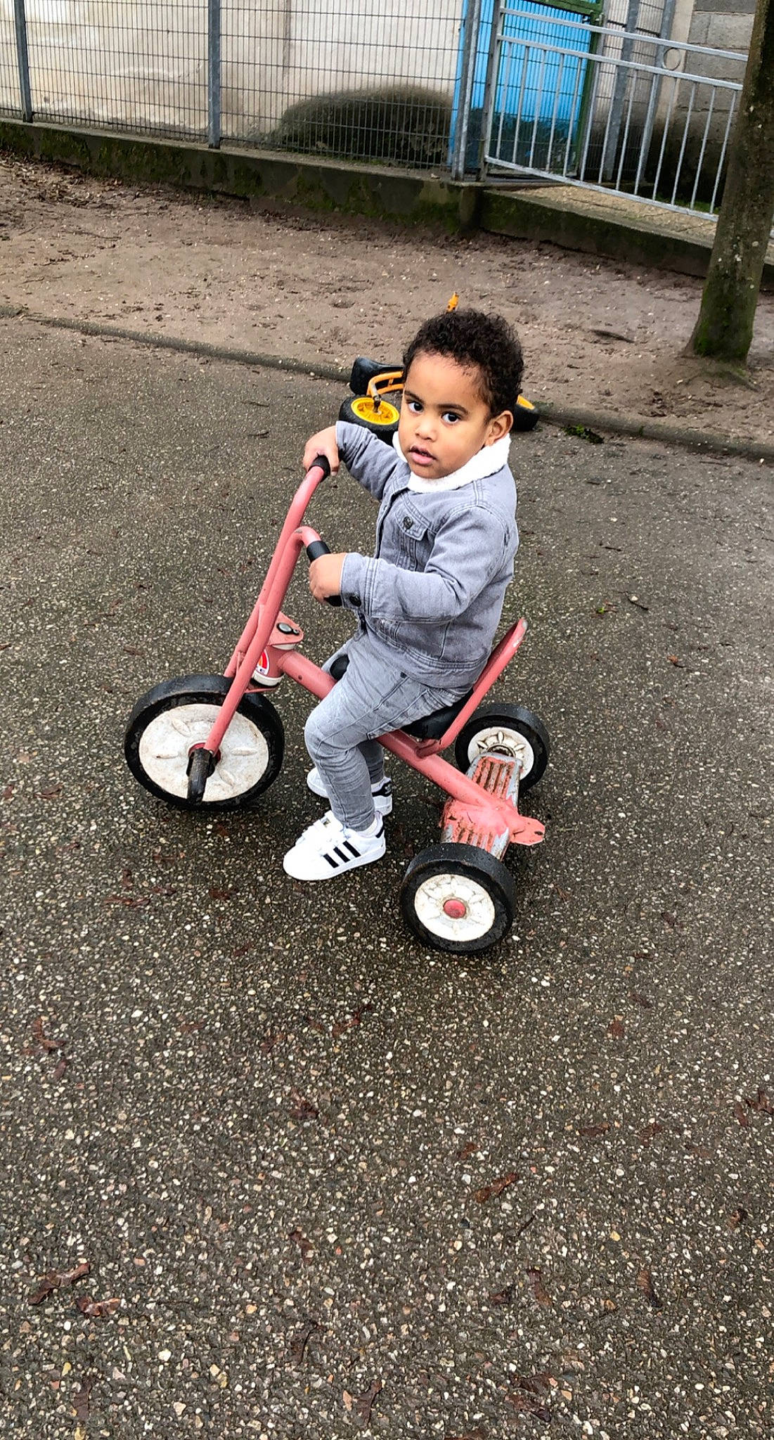 Kyle participe au concours pour gagner de l'argent avec cette photo : baby, baby_toddler_clothing, bicycle, child, guard_rail, person, play, product, riding_toy, rolling, sneakers, tire, toddler, walking_shoe, wheel