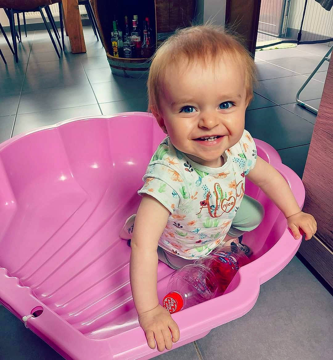 Reley participe au concours pour gagner de l'argent avec cette photo : baby, baby_products, baby_toddler_clothing, chair, child, comfort, fun, happy, joy, lap, magenta, organ, person, photograph, pink, product, purple, sitting, skin, smile