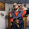 Teddy joined the competition — help win amazing prizes! animal, brown_dog, casual, cozy_room, cute, dachshund, decor, dog, fireplace, funny_pose, hand_gesture, indoor, jacket, lamp, man, painting, pet, portrait, shelf, sunglasses