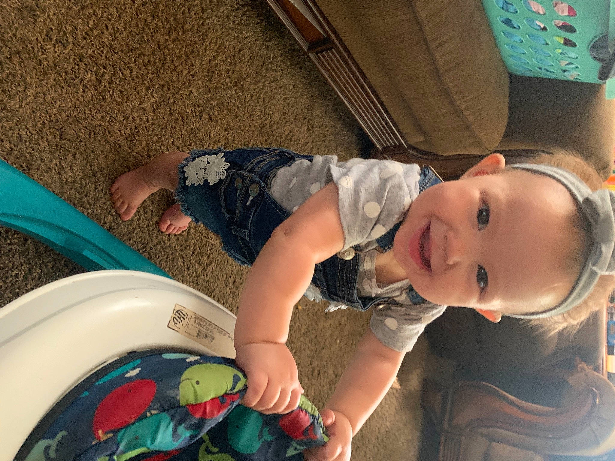 Londyn is registered to the contest to win money with this photo: automotive_exterior, baby, baby_products, baby_toddler_clothing, bumper, child, fun, happy, hat, human_leg, joy, leisure, mouth, people, person, recreation, sitting, smile, snapshot, thigh