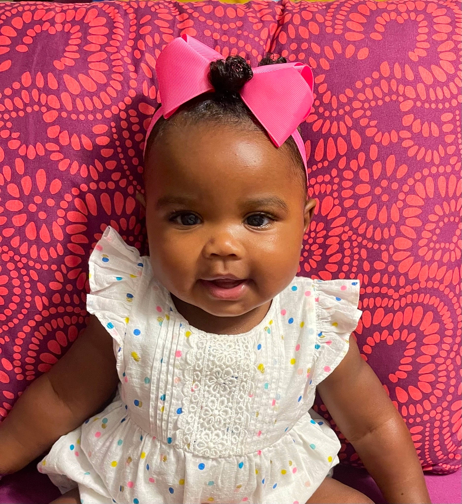 Journee is registered to the contest to win money with this photo: baby, baby_toddler_clothing, cheek, chin, cool, dress, eye, eyelash, facial_expression, happy, head, iris, lip, organ, person, pink, purple, red, skin, sleeve