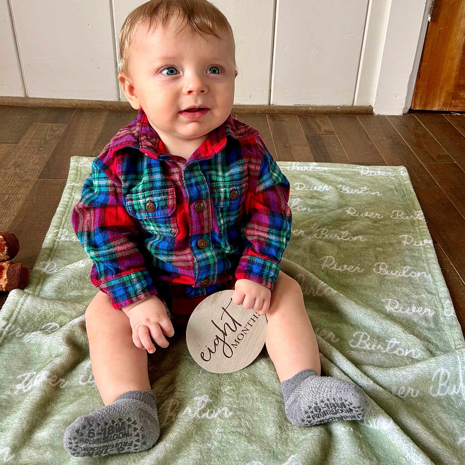 River is registered to the contest to win money with this photo: boy, child, clothing, cushion, face, footwear, furniture, head, homedecor, hosiery, male, pants, person, photography, portrait, shirt, shoe, shorts, sitting, sock