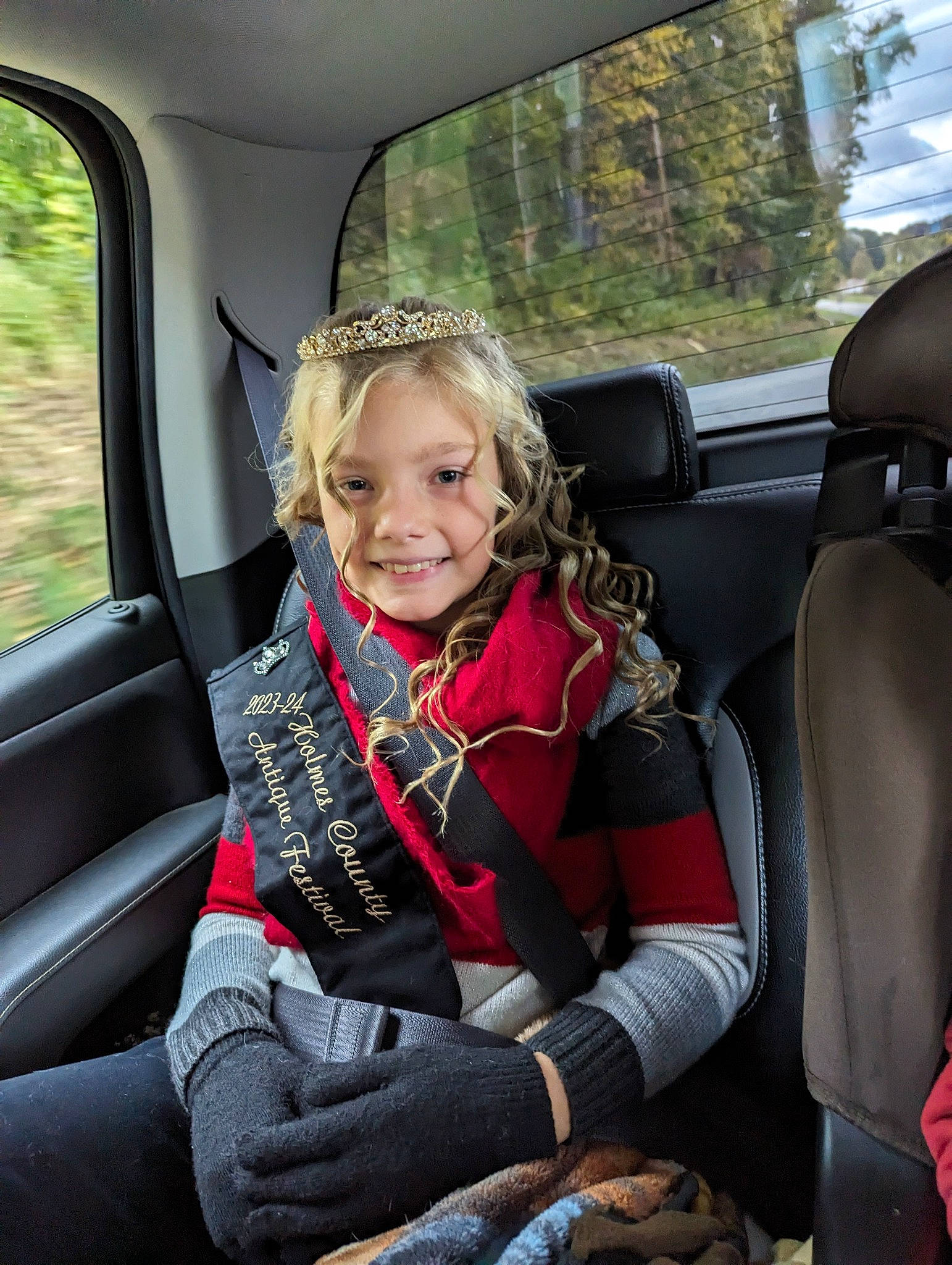 Audrey joined the competition — help win amazing prizes! auto_part, automotive_design, automotive_exterior, car, car_seat, car_seat_cover, comfort, face, fun, head_restraint, joy, mode_of_transport, motor_vehicle, person, plant, smile, steering_part, toddler, tree, vehicle