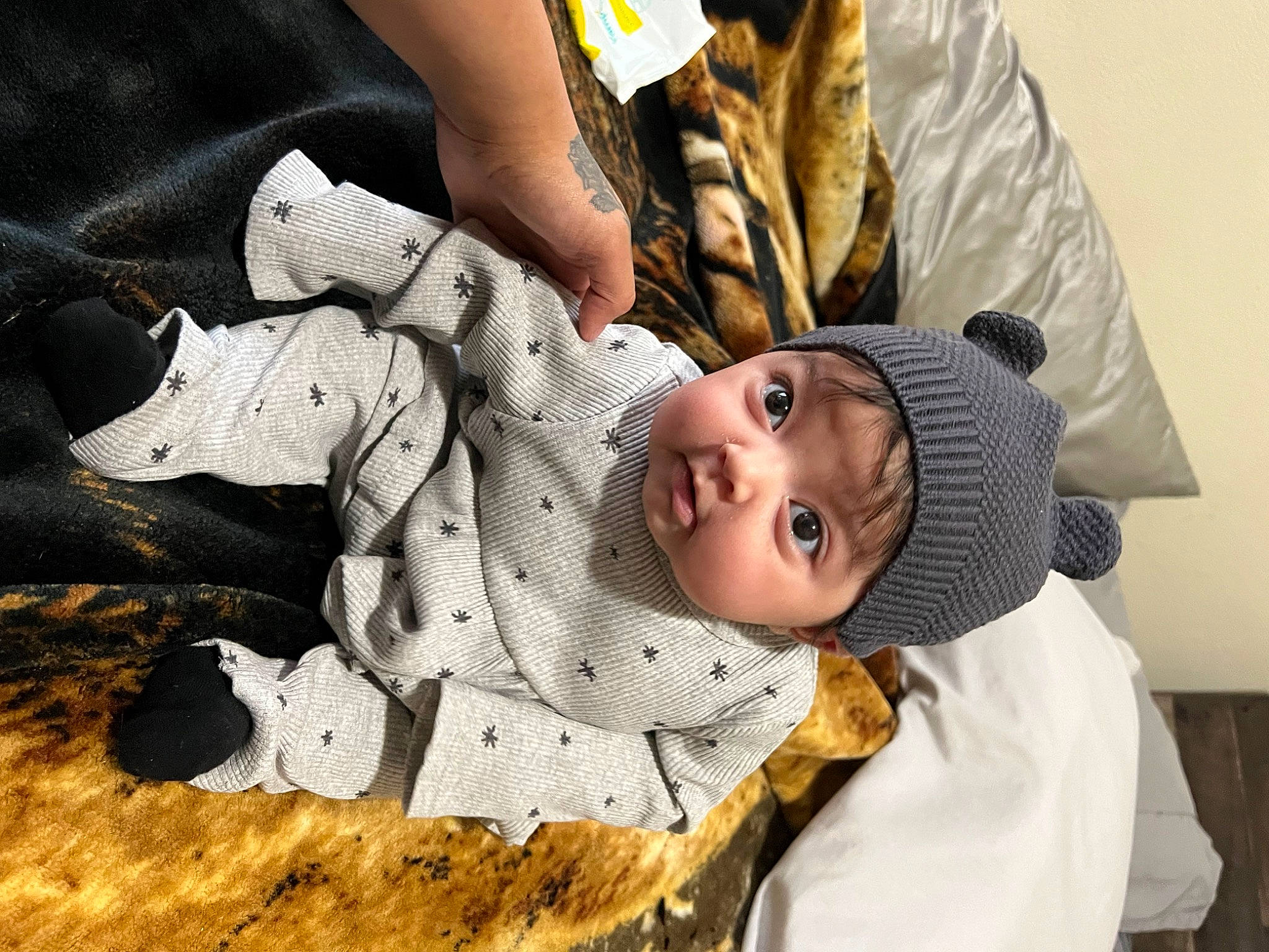 Lailani joined the competition — help win amazing prizes! baby, child, comfort, eye, fun, fur, gesture, happy, headwear, human_body, outerwear, pattern, person, sitting, sleeve, toddler, tree, winter, wood