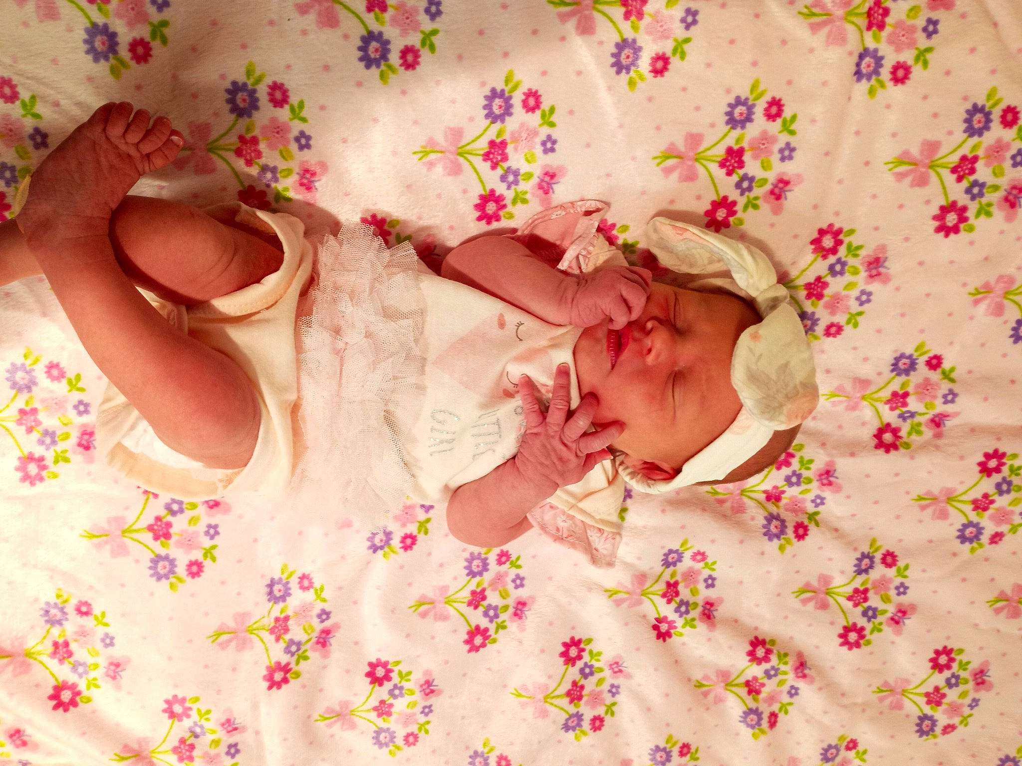 Pandora is registered to the contest to win money with this photo: baby, baby_sleeping, baby_toddler_clothing, bed_sheet, bedding, bedtime, child, comfort, finger, hand, linens, magenta, pattern, person, petal, pink, product, room, sweetness, textile