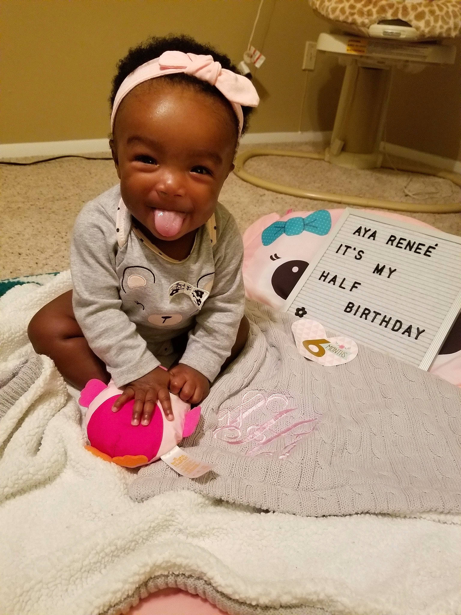 Aya is registered to the contest to win money with this photo: cat, child, infant, joy, mammal, person, pink, play, product, skin, textile, toddler