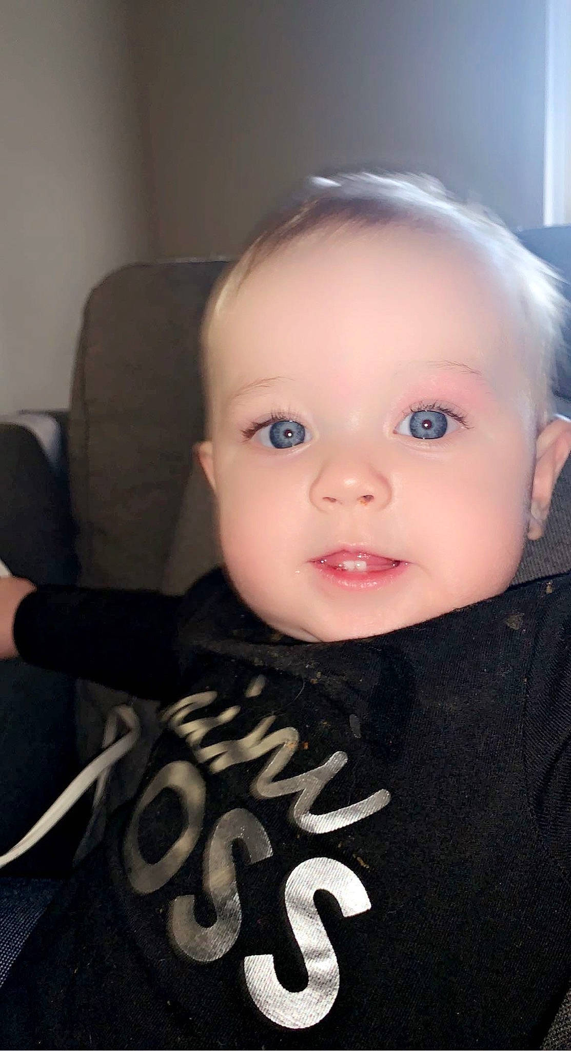 Lilith joined the competition — help win amazing prizes! baby, baby_toddler_clothing, chair, cheek, child, eyebrow, eyelash, flash_photography, fun, iris, lip, monochrome_photography, no_expression, person, portrait_photography, room, sitting, sleeve, smile, t_shirt