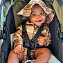accessories, baby, baseballcap, cap, clothing, coat, face, footwear, happy, hat, head, jacket, pants, person, photography, portrait, shoe, shorts, smile, stroller