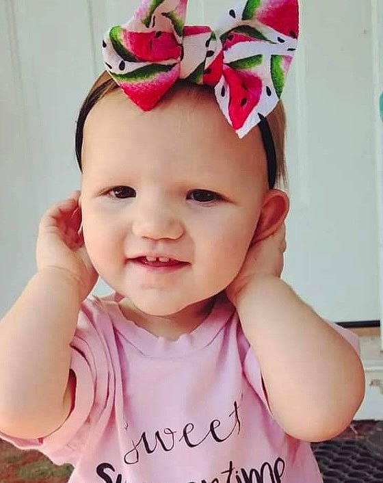 Charleigh joined the competition — help win amazing prizes! baby, baby_toddler_clothing, cap, cheek, clothing, costume_hat, eyelash, face, happy, headband, headpiece, headwear, jewellery, joy, lip, pattern, person, pink, skin, sleeve