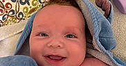 Malachi joined the competition — help win amazing prizes! baby, smile, towel, blue, blanket, pattern, happy, face, child, skin, head, eyes, newborn, infant, closeup, cute, indoor, portrait, babycare, fresh