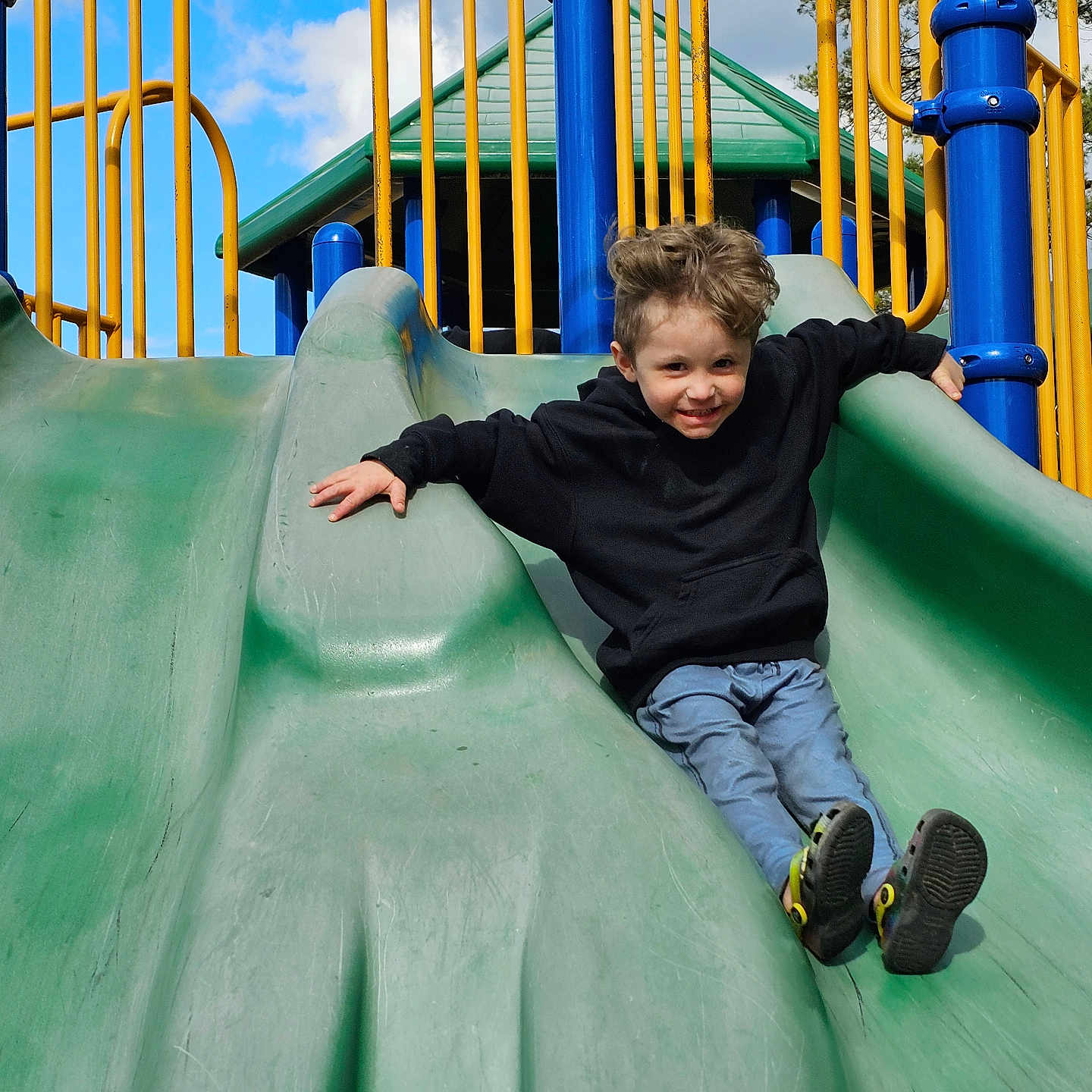 Bryson joined the competition — help win amazing prizes! boy, child, clothing, face, footwear, grass, jeans, male, nature, outdoorplayarea, outdoors, pants, park, person, plant, playarea, shoe, slide, sliding, toy