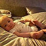Kash joined the competition — help win amazing prizes! baby, infant, bed, pillow, blanket, clothing, person, skin, head, face, legs, feet, sleepwear, room, indoors, relaxation, soft, comfort, cushion, child