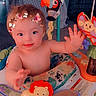 Winona joined the competition — help win amazing prizes! baby, child, infant, butterflies, toy_lion, toy_parrot, activity_center, indoor, playful, smiling, cute, blue_eyes, hair, hand, face, carpet, furniture, colorful, crawling, happy