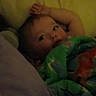 Winona joined the competition — help win amazing prizes! baby, blanket, couch, child, face, infant, indoors, person, resting, sleepy, soft, toddler, young, wrapped, lying, cover, casual, comfort, relaxation, dim_light