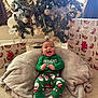 Reshard joined the competition — help win amazing prizes! baby, child, christmas_tree, christmas_presents, holiday, festive_clothing, green_pajamas, santa_claus, smiling, happy, blanket, carpet, indoors, decorations, ornaments, lights, wrapped_gifts, cozy, celebration, festivity