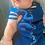 Muhammad Zaviyar joined the competition — help win amazing prizes! baby, child, infant, blue_outfit, striped_shirt, hand, sunlight, soft_skin, curious_expression, indoors, fabric, buttons, sitting, person, cute, face, arm, closeup, portrait, warm_light