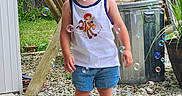 Madison joined the competition — help win amazing prizes! toddler, child, outdoor, bubbles, soap_bubbles, grass, wooden_chair, fence, plant, pot, trash_can, shorts, tank_top, footwear, curly_hair, expression, sidewalk, gravel, summer, playful