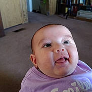 Harvest joined the competition — help win amazing prizes! baby, child, smiling, tongue_out, purple_shirt, indoor, carpet, bookshelf, furniture, face, head, happy, person, young_child, cute, expression, clothing, room, light, portrait