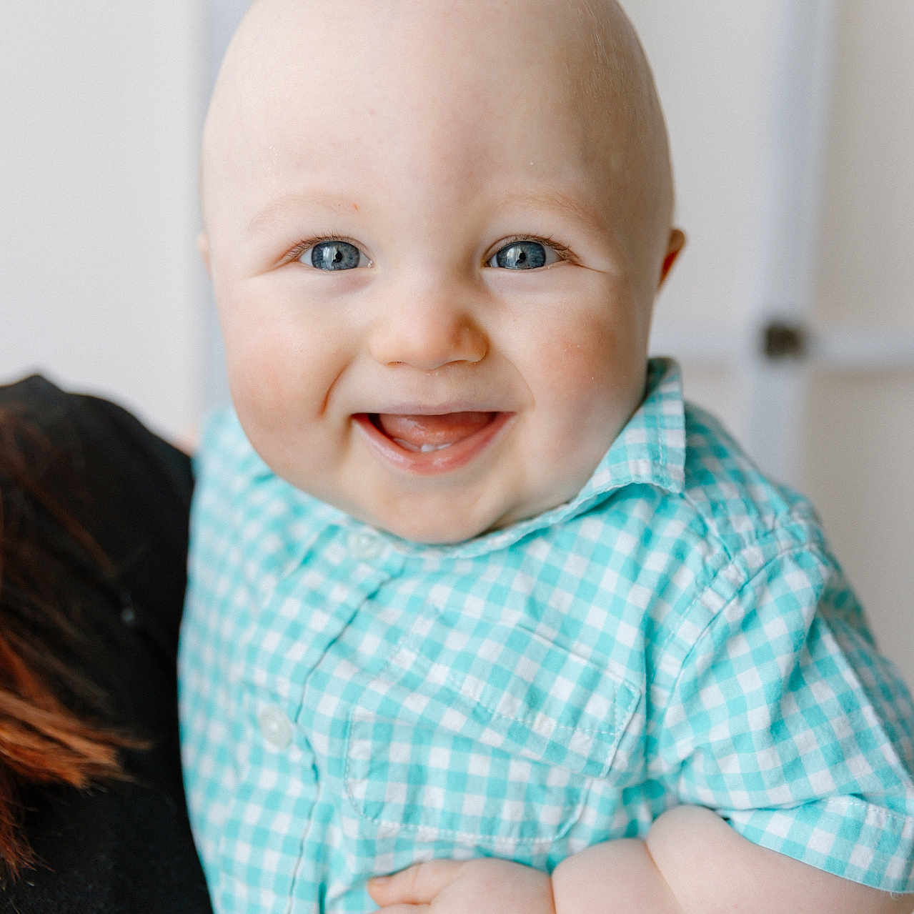 Elijah joined the competition — help win amazing prizes! baby, blue_eyes, checkered_shirt, child, close_up, clothing, cute, face, hand, happy, human, indoor, infant, light_background, person_holding, portrait, short_sleeves, skin, smiling, young_child