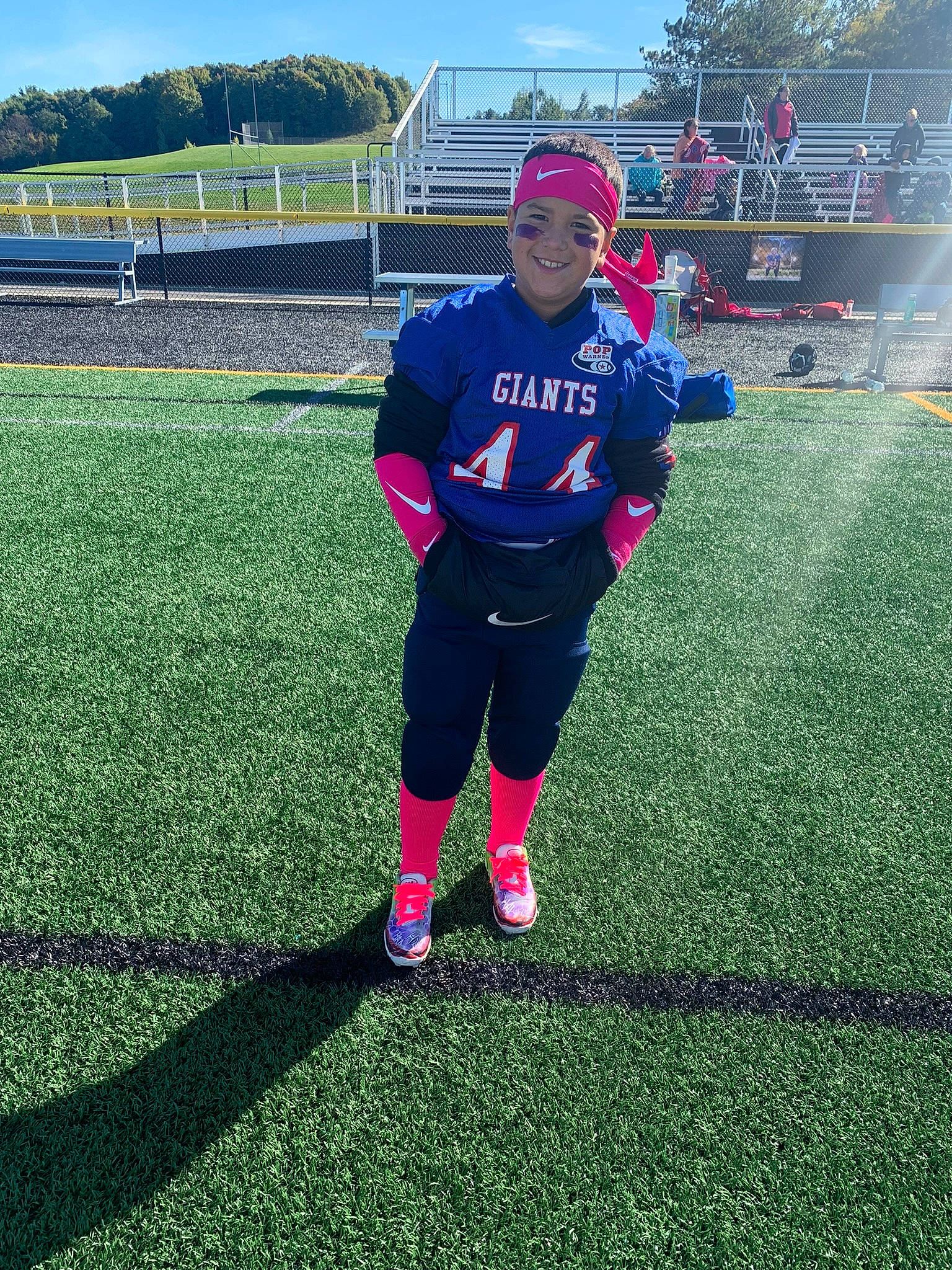 Jayceon is registered to the contest to win money with this photo: ball_game, competition_event, football, grass, grassland, headwear, jersey, joy, leisure, magenta, person, plant, player, recreation, sky, sports, sports_equipment, sports_uniform, sportswear, t_shirt