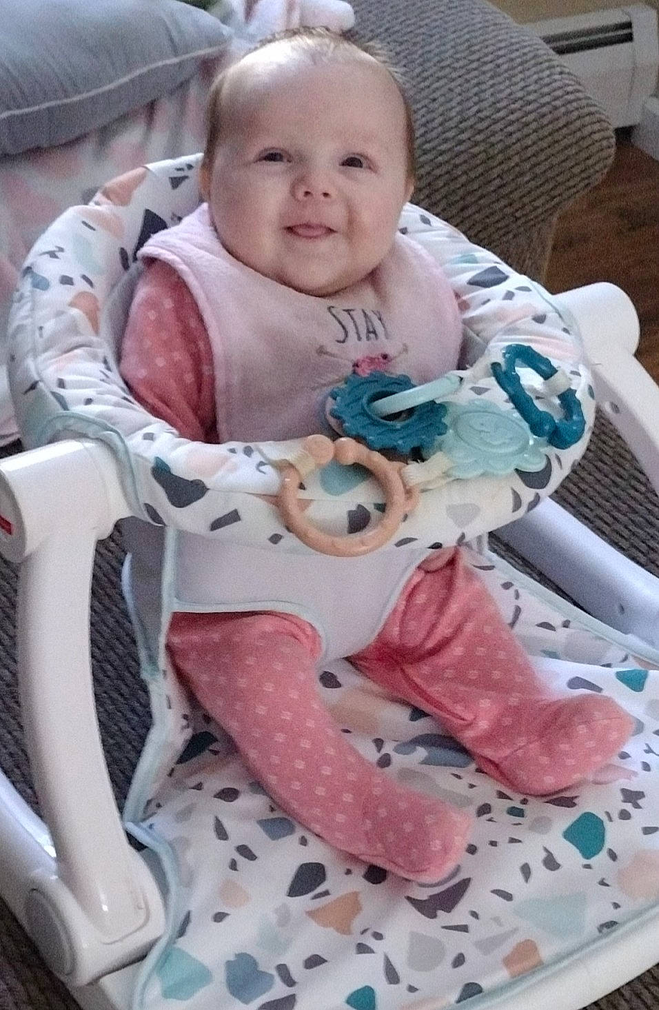 Liliana is registered to the contest to win money with this photo: baby, baby_carriage, baby_in_car_seat, baby_products, baby_safety, baby_toddler_clothing, baby_toys, carmine, chair, cheek, child, comfort, linens, pattern, person, pink, service, sitting, smile, toddler