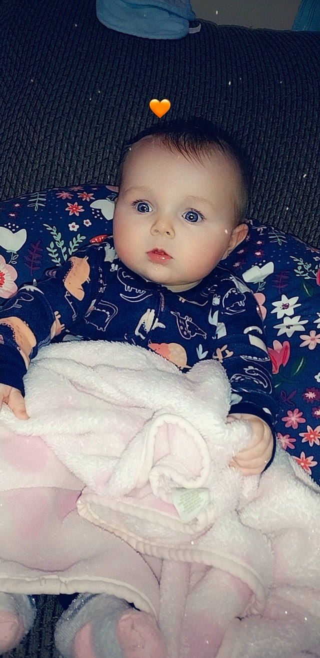 Liliana is registered to the contest to win money with this photo: baby, baby_sleeping, baby_toddler_clothing, cheek, child, comfort, eye, eyelash, head, iris, lip, nose, organ, pattern, person, pink, product, skin, sleeve, textile