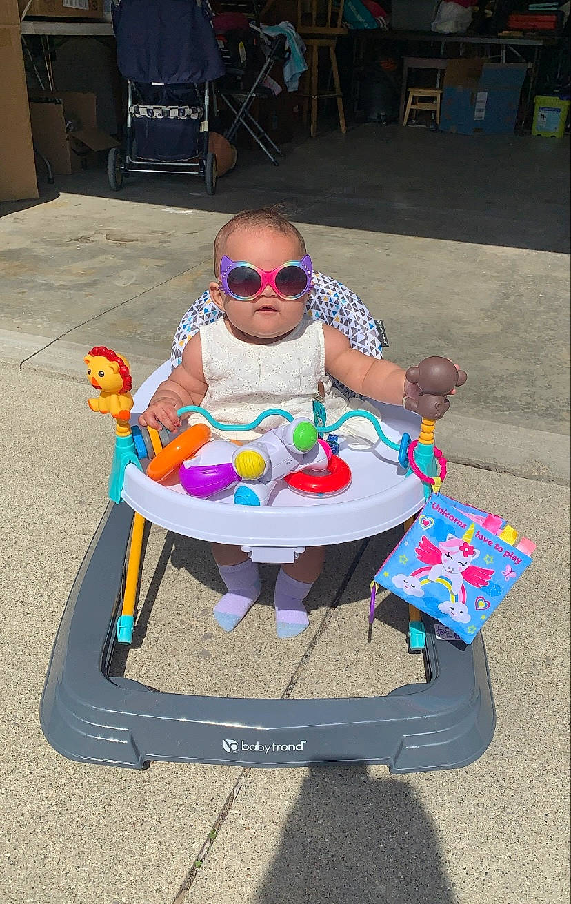 Jacquelyn joined the competition — help win amazing prizes! baby_toddler_clothing, chair, child, entertainment, event, eyewear, fun, goggles, leisure, outdoor_furniture, person, plastic, play, recreation, sitting, smile, sunglasses, table, toddler, vision_care