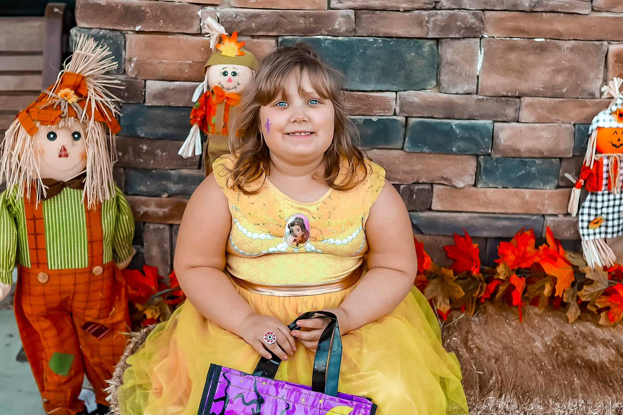 Caitlin is registered to the contest to win money with this photo: child, costume, entertainment, event, fashion_design, fawn, fun, happy, jewellery, joy, leisure, necklace, orange, person, plant, recreation, sitting, smile, street_fashion, summer