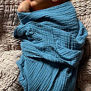 Slayder is registered to the contest to win money with this photo: baby, blanket, blue_blanket, child, closeup, cozy, cuteness, human, indoors, infant, natural_light, newborn, peaceful, portrait, resting, sleeping, soft, texture, toddler, wrapped