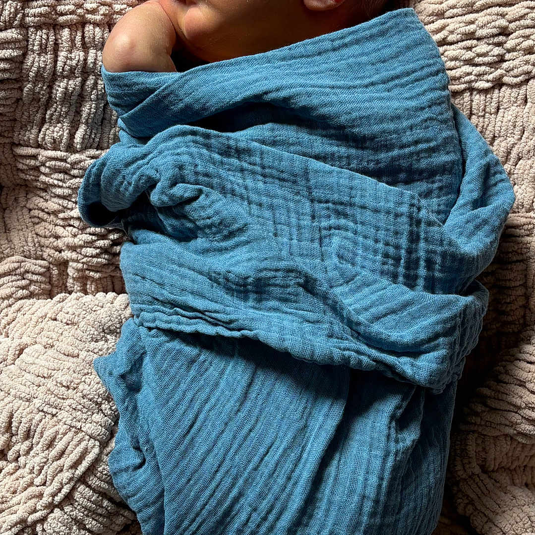 Slayder is registered to the contest to win money with this photo: baby, blanket, blue_blanket, child, closeup, cozy, cuteness, human, indoors, infant, natural_light, newborn, peaceful, portrait, resting, sleeping, soft, texture, toddler, wrapped