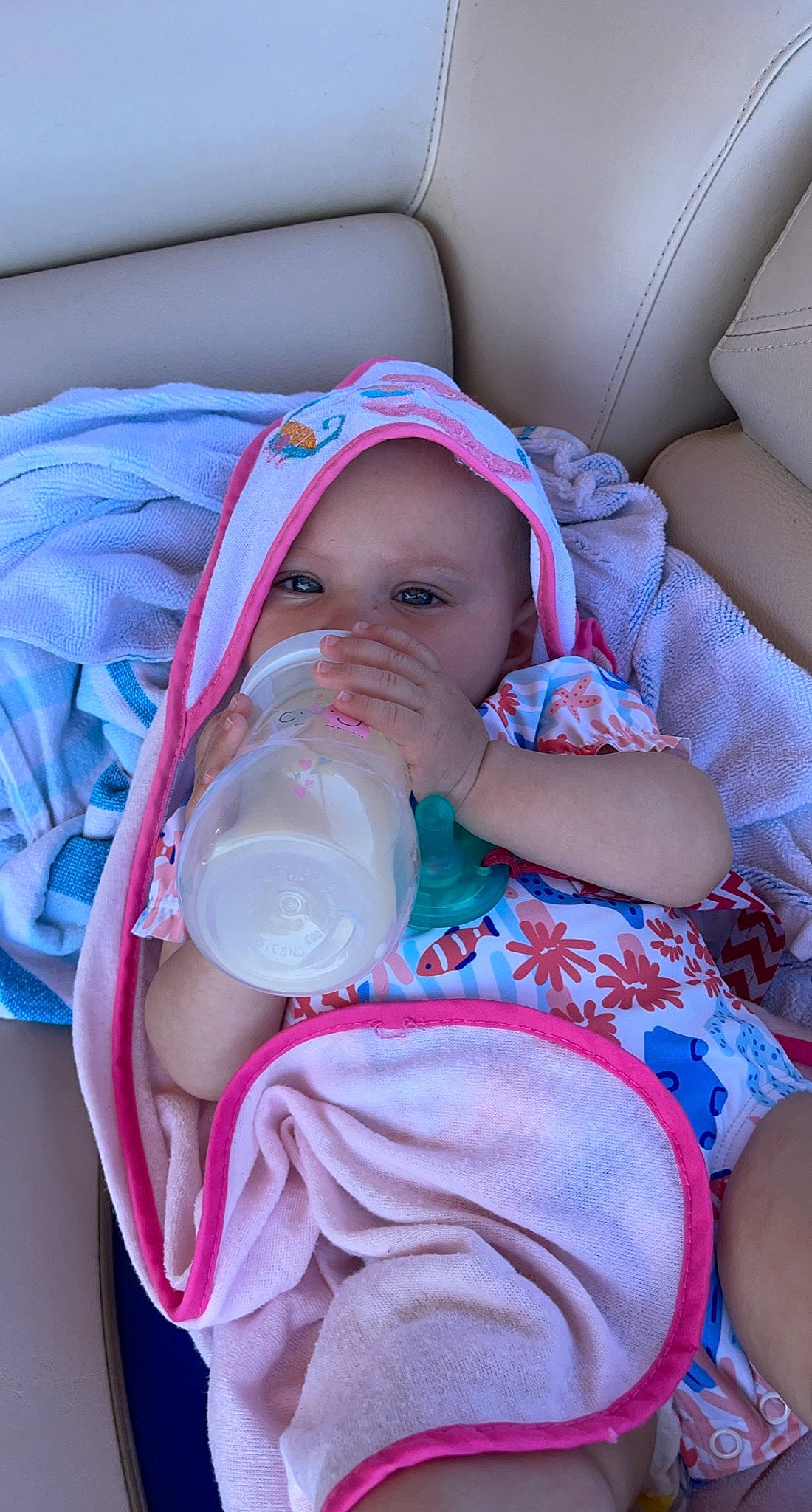 Kinzley is registered to the contest to win money with this photo: baby, baby_bottle, baby_carriage, baby_toddler_clothing, bottle, cheek, comfort, drinkware, finger, headgear, headwear, lip, mouth, nail, person, pink, plastic_bottle, product, skin, textile