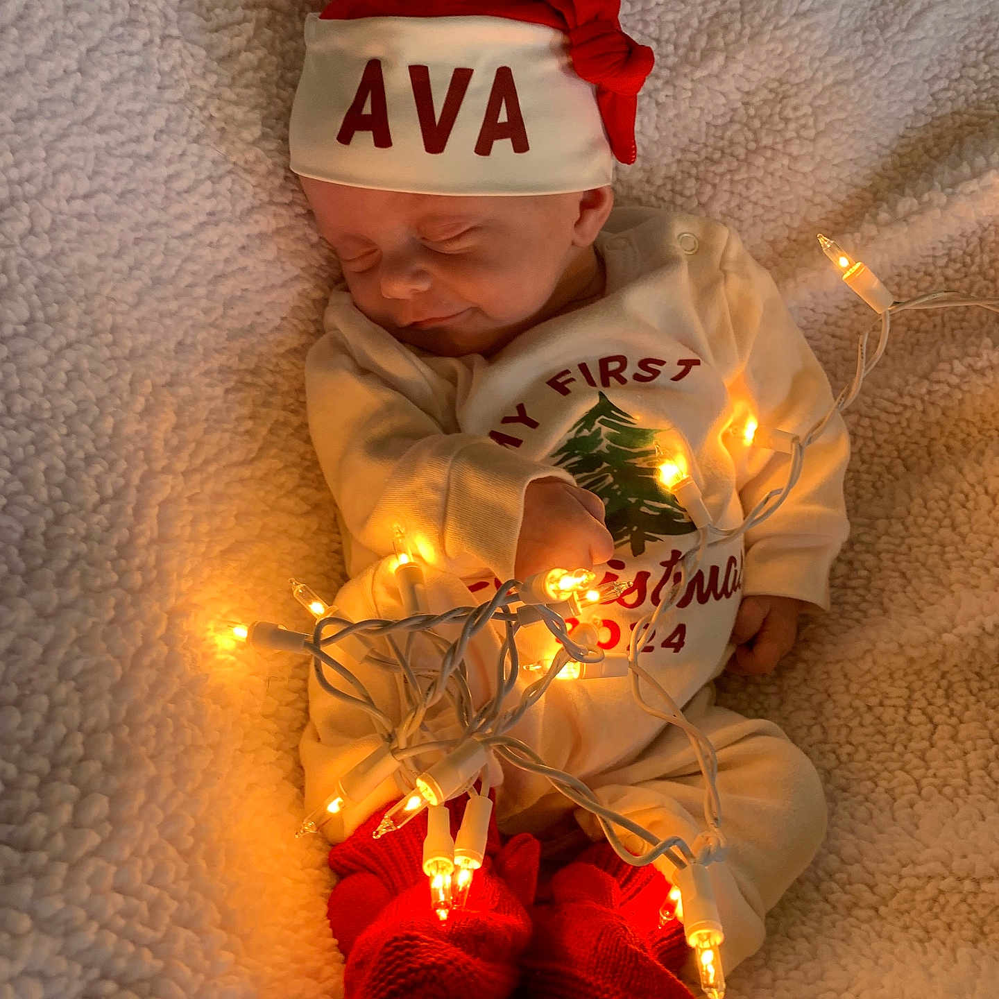 Ava is registered to the contest to win money with this photo: baby, blanket, bodypart, bonnet, cap, clothing, couch, face, finger, flower, furniture, glove, hand, hat, head, newborn, person, photography, portrait, sleeping